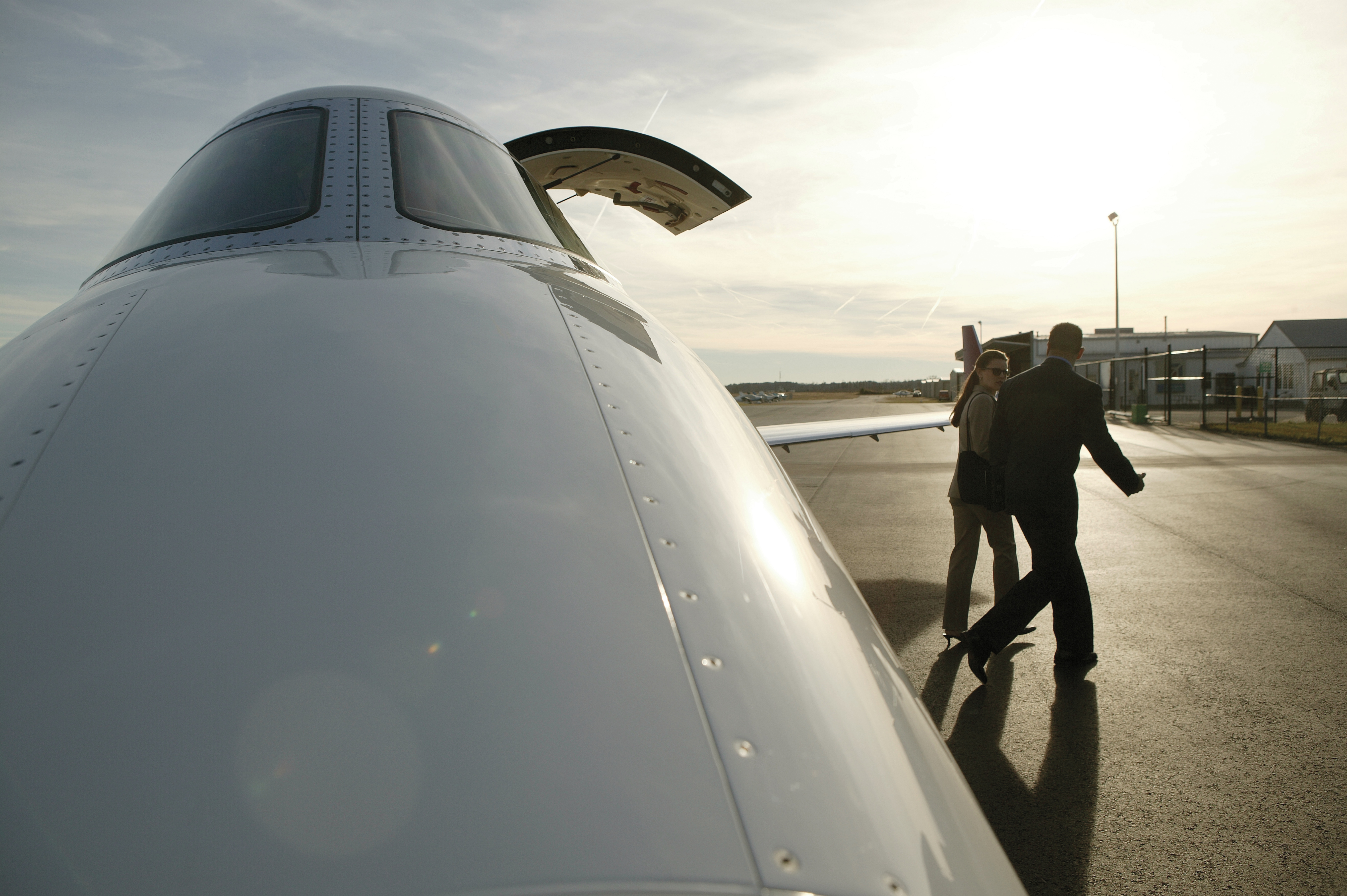 Two people next to an aircraft